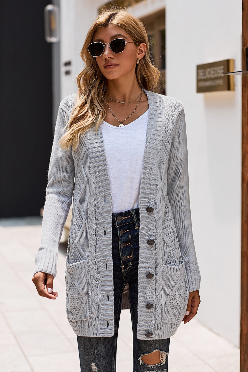 Cardigan avec poche avant et fermeture a boutons