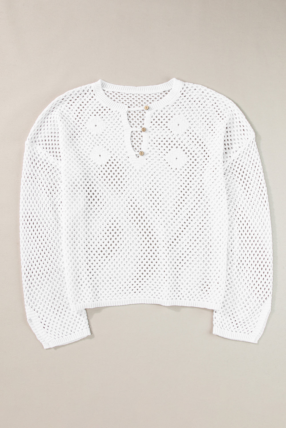 Pull en tricot ouvert à col boutonné et manches fendues