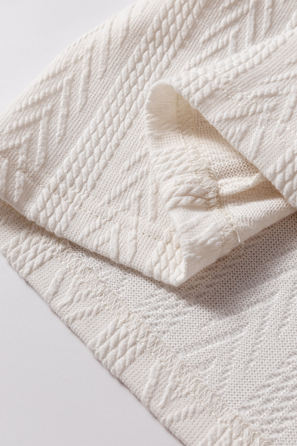 Chemisier à col en V avec cordon de serrage en tricot texturé patchwork floral