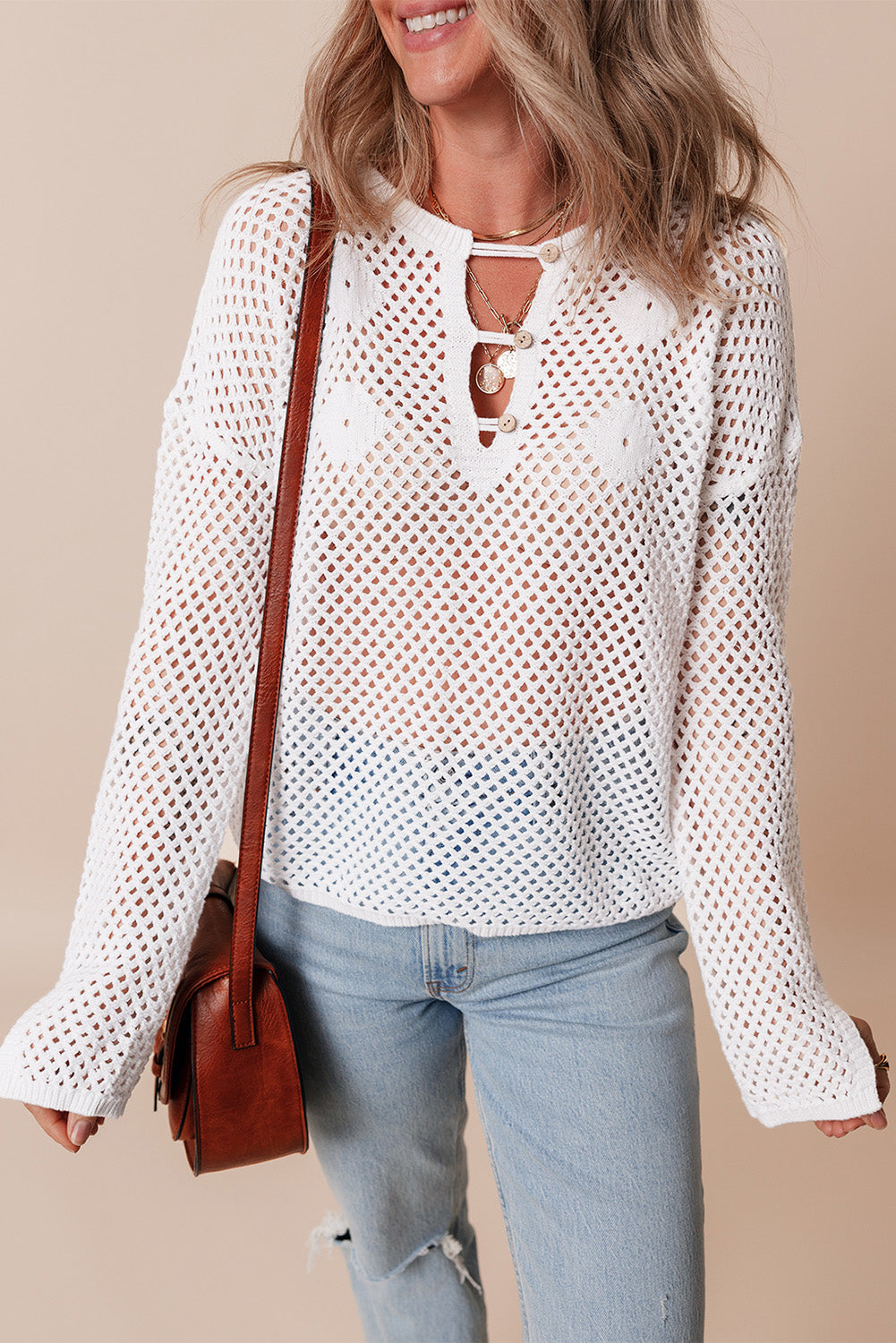 Pull en tricot ouvert à col boutonné et manches fendues