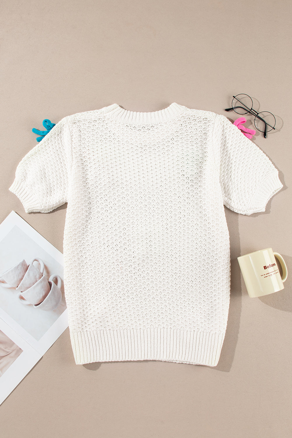 Pull a manches courtes et col montant en tricot avec nœud coloré