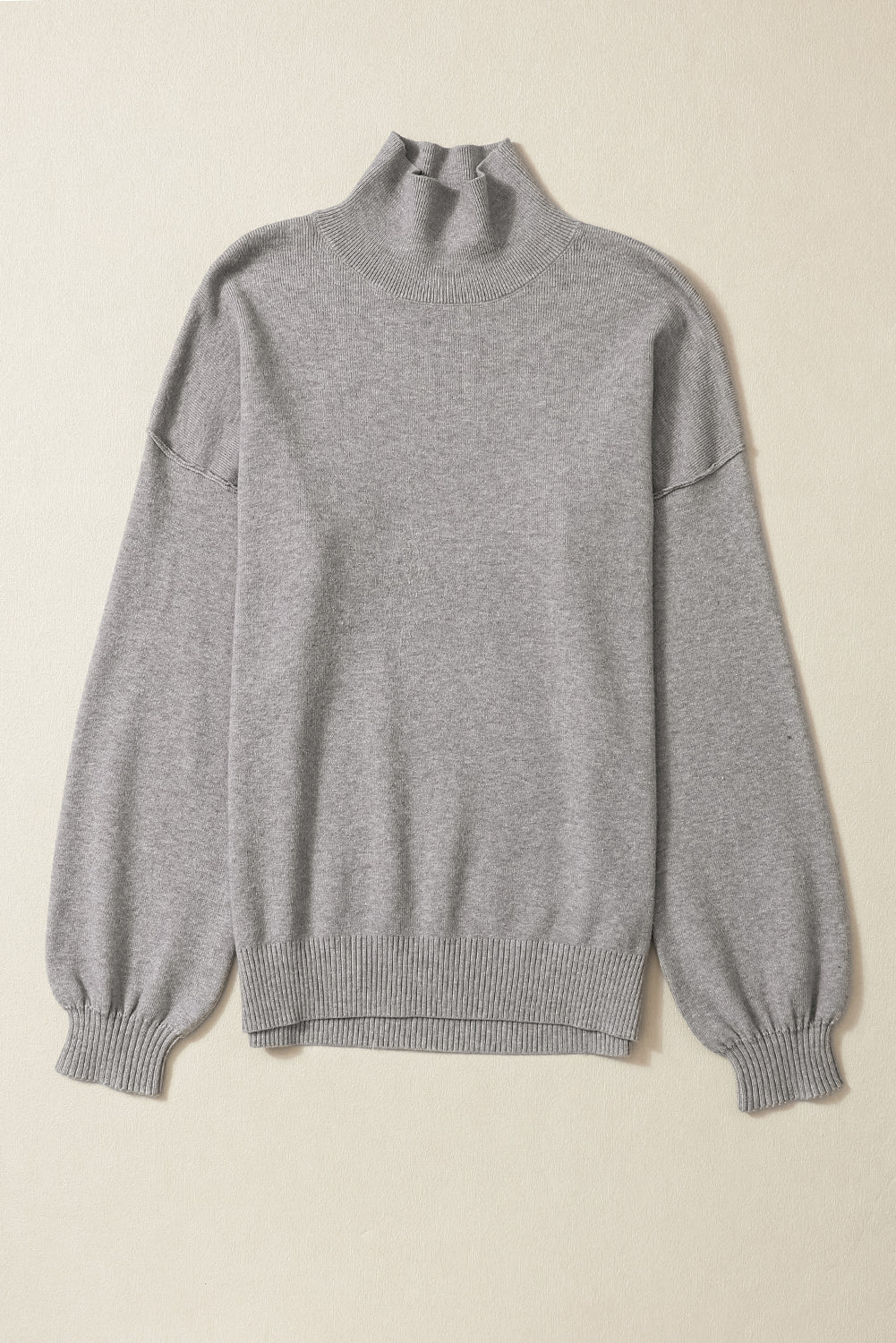 Pull en tricot à col roulé, épaules tombantes et manches bulles