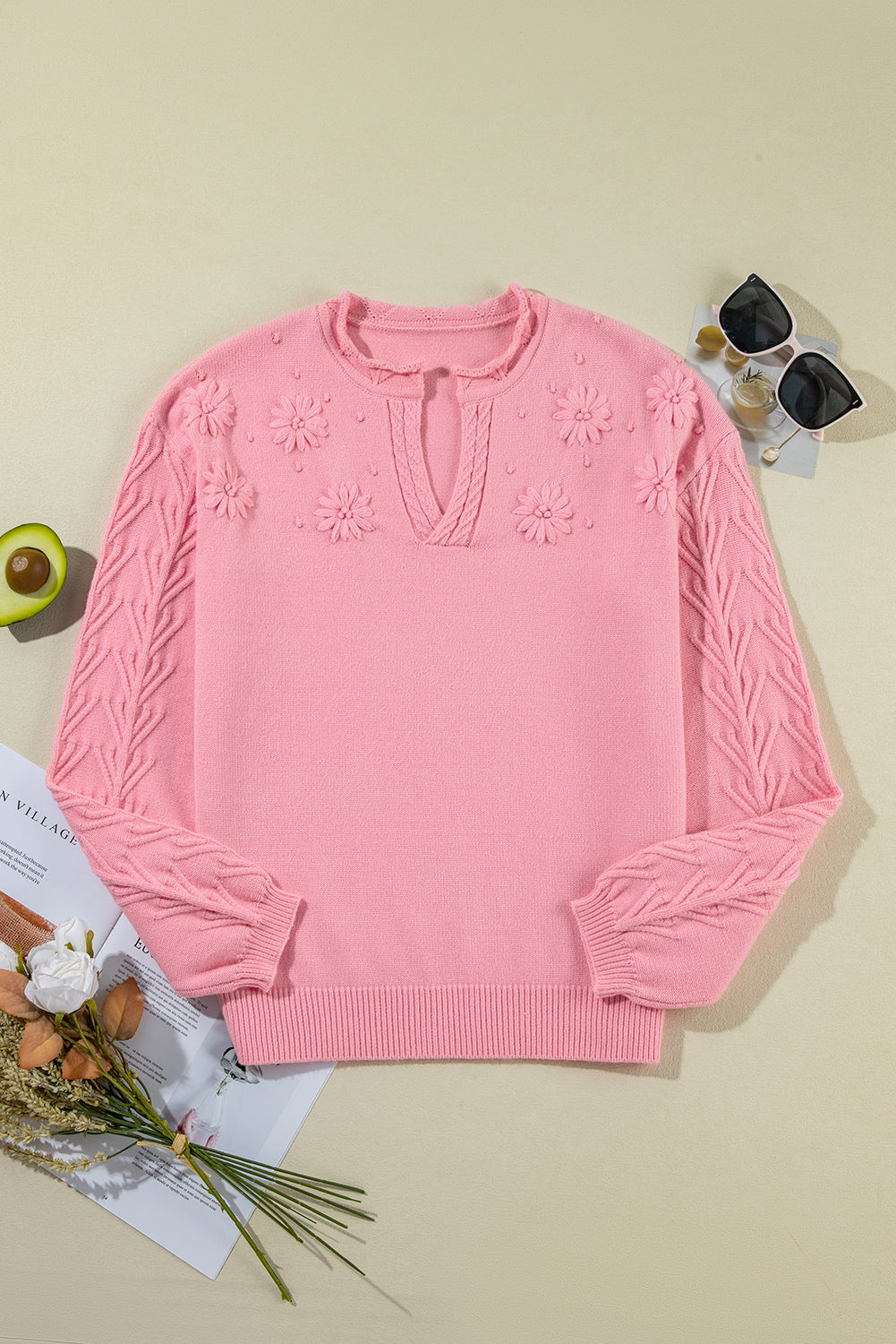 Pull tricoté à col cranté et détail floral