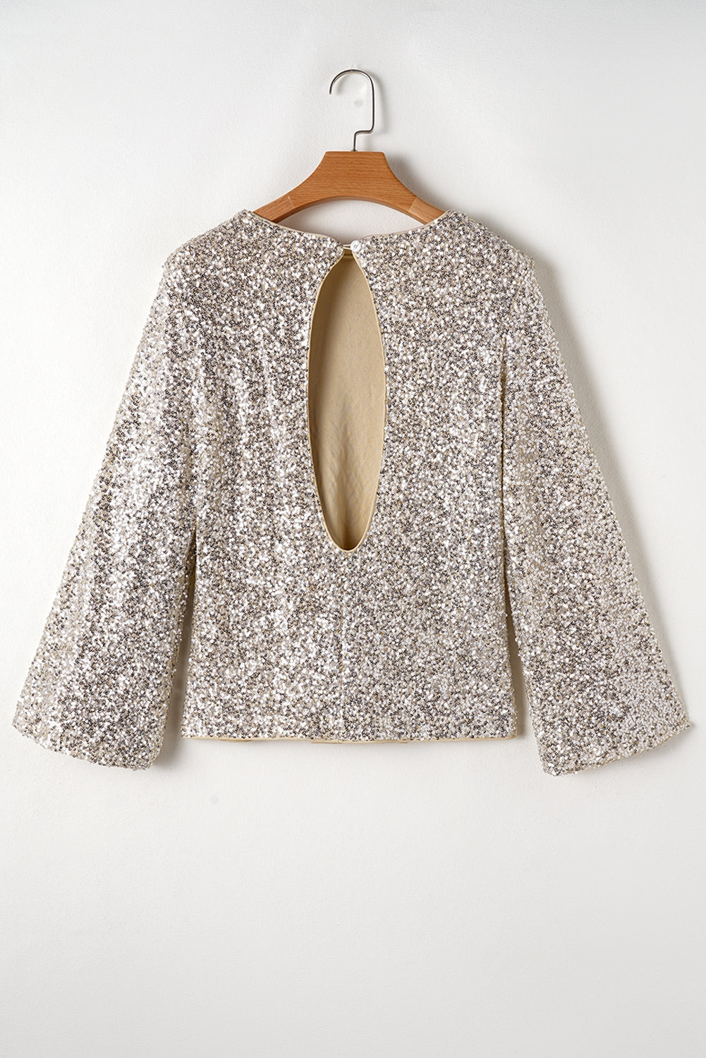 Blouse découpée au dos à manches bouffantes et sequins