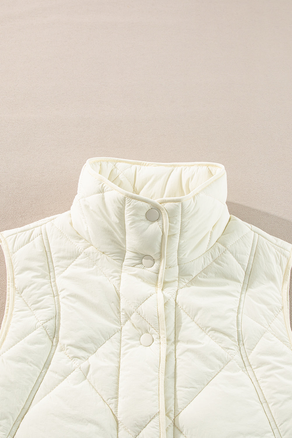 Manteau gilet matelassé a col haut et boutonné avec poche
