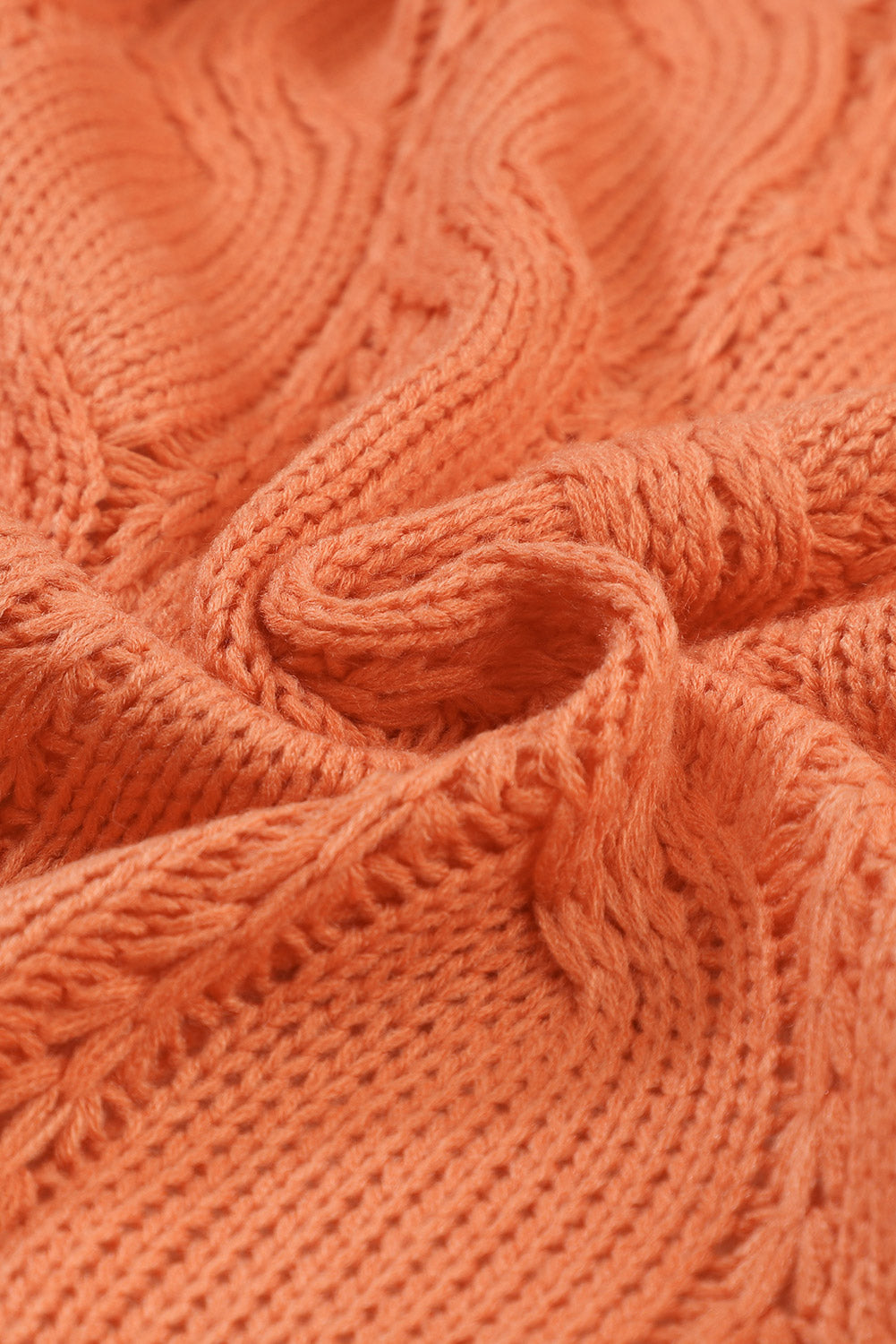 Cardigan en maille torsadée a œillets et bordure côtelée