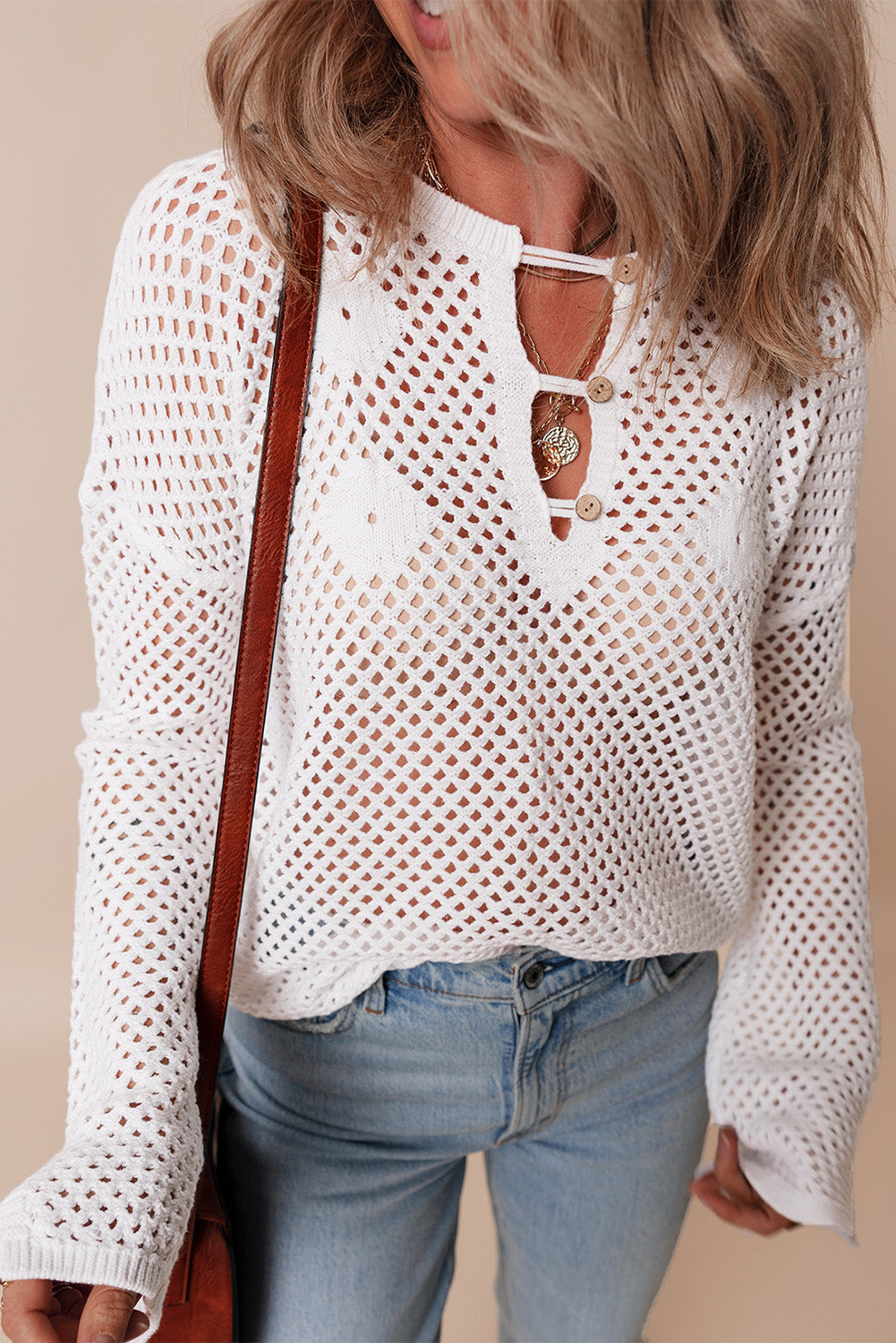 Pull en tricot ouvert à col boutonné et manches fendues