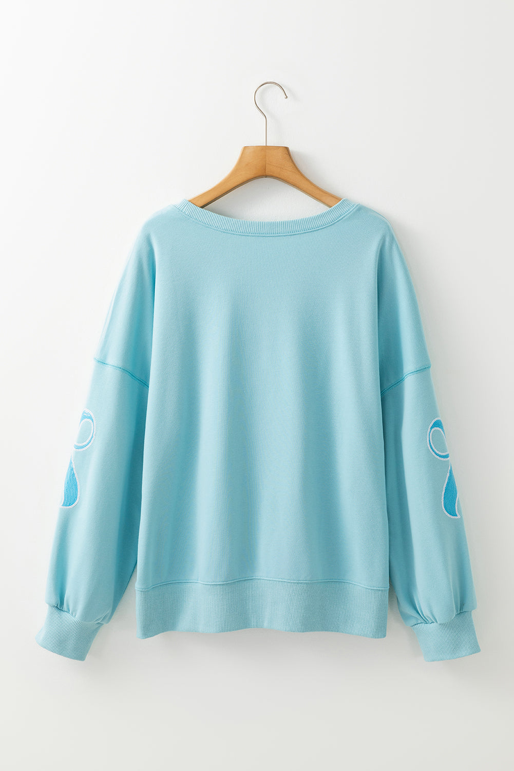Sweat-shirt oversize à épaules tombantes et nœud papillon pailleté