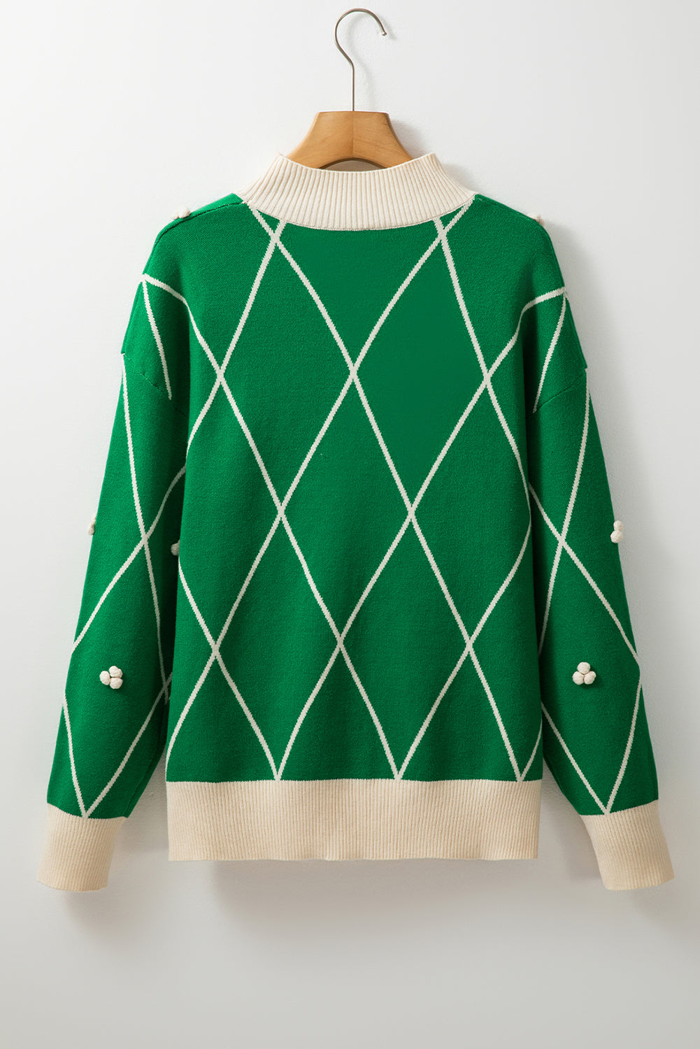 Pull a col haut avec bordure contrastée et accents de pompons a motif diamant