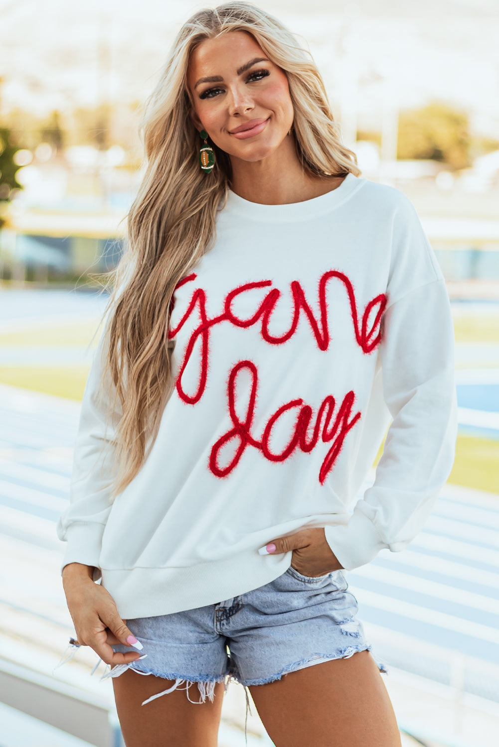 Tinsel Game Day - Sweat-shirt graphique à épaules tombantes