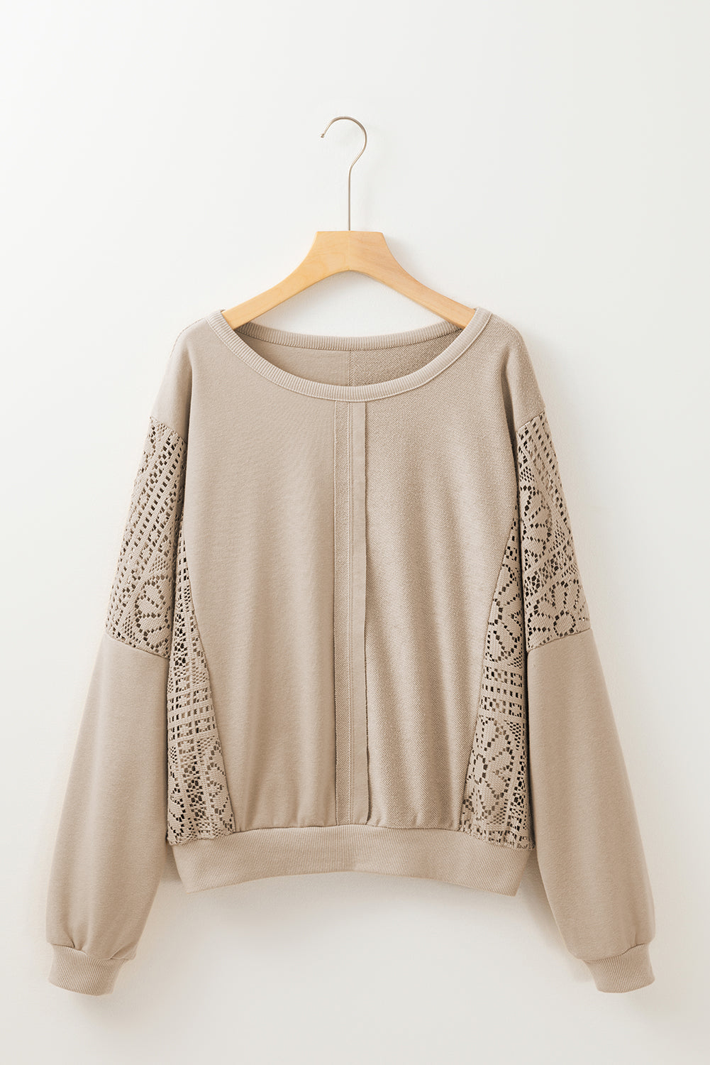 Sweat-shirt en tricot au crochet avec coutures apparentes et bordure côtelée