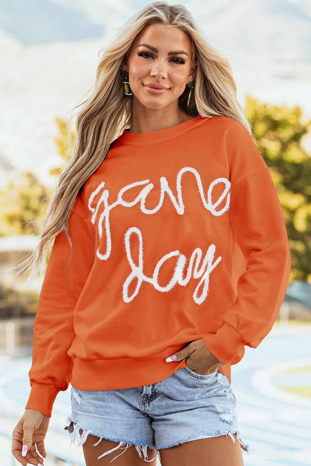 Tinsel Game Day - Sweat-shirt graphique a épaules tombantes