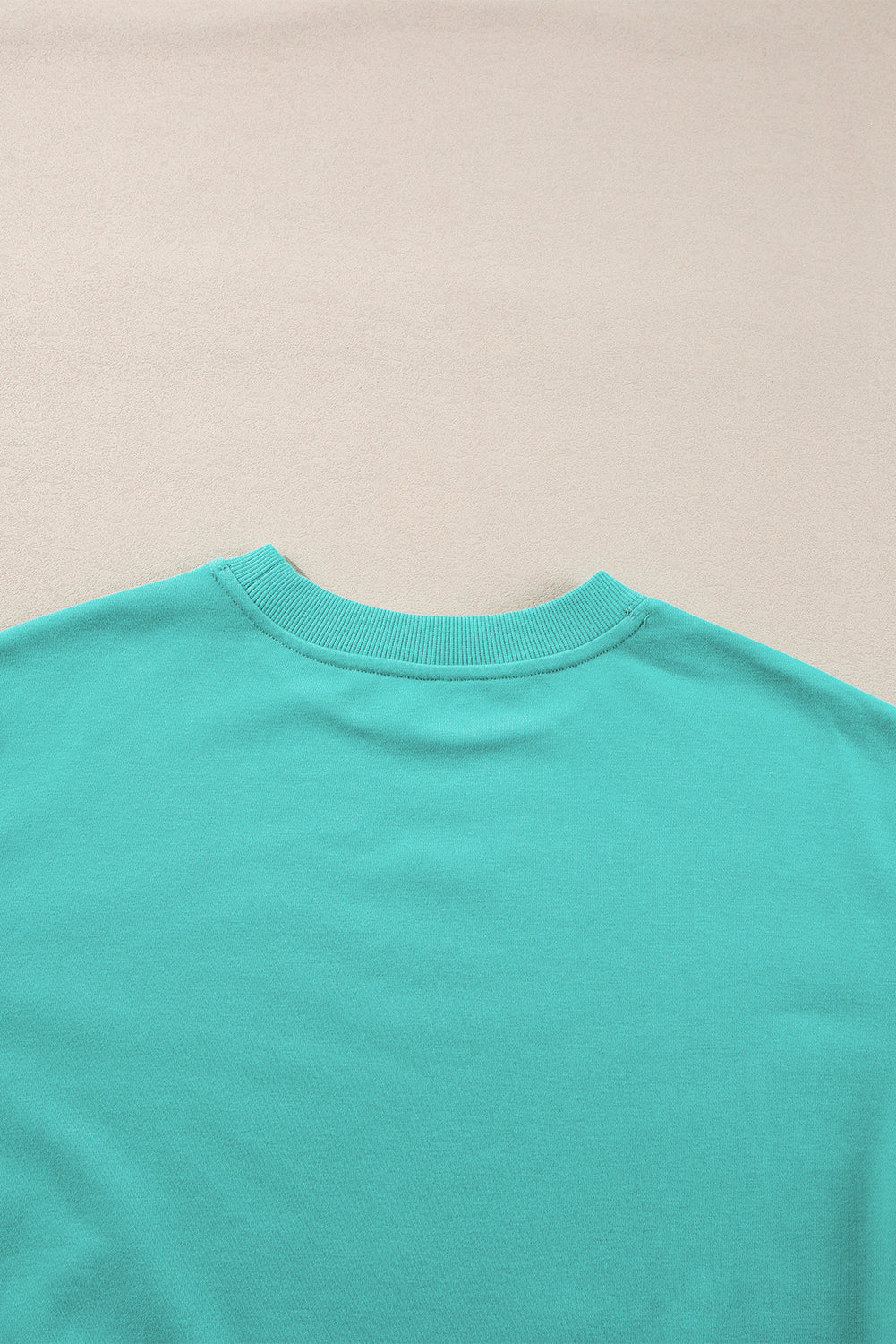Sweat-shirt uni a col rond et épaules tombantes